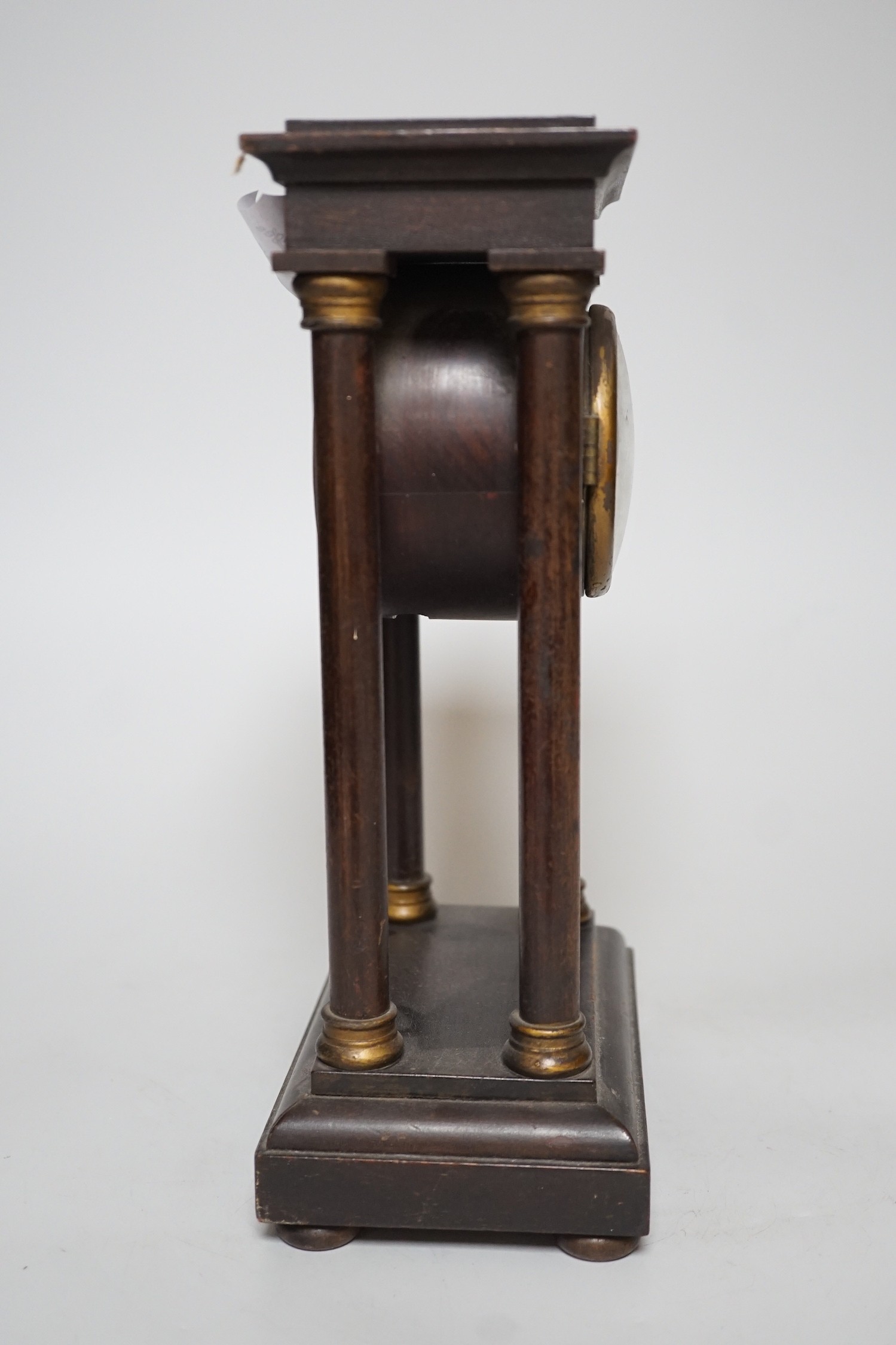 An Edwardian Portico-type mantel clock, 27cms high